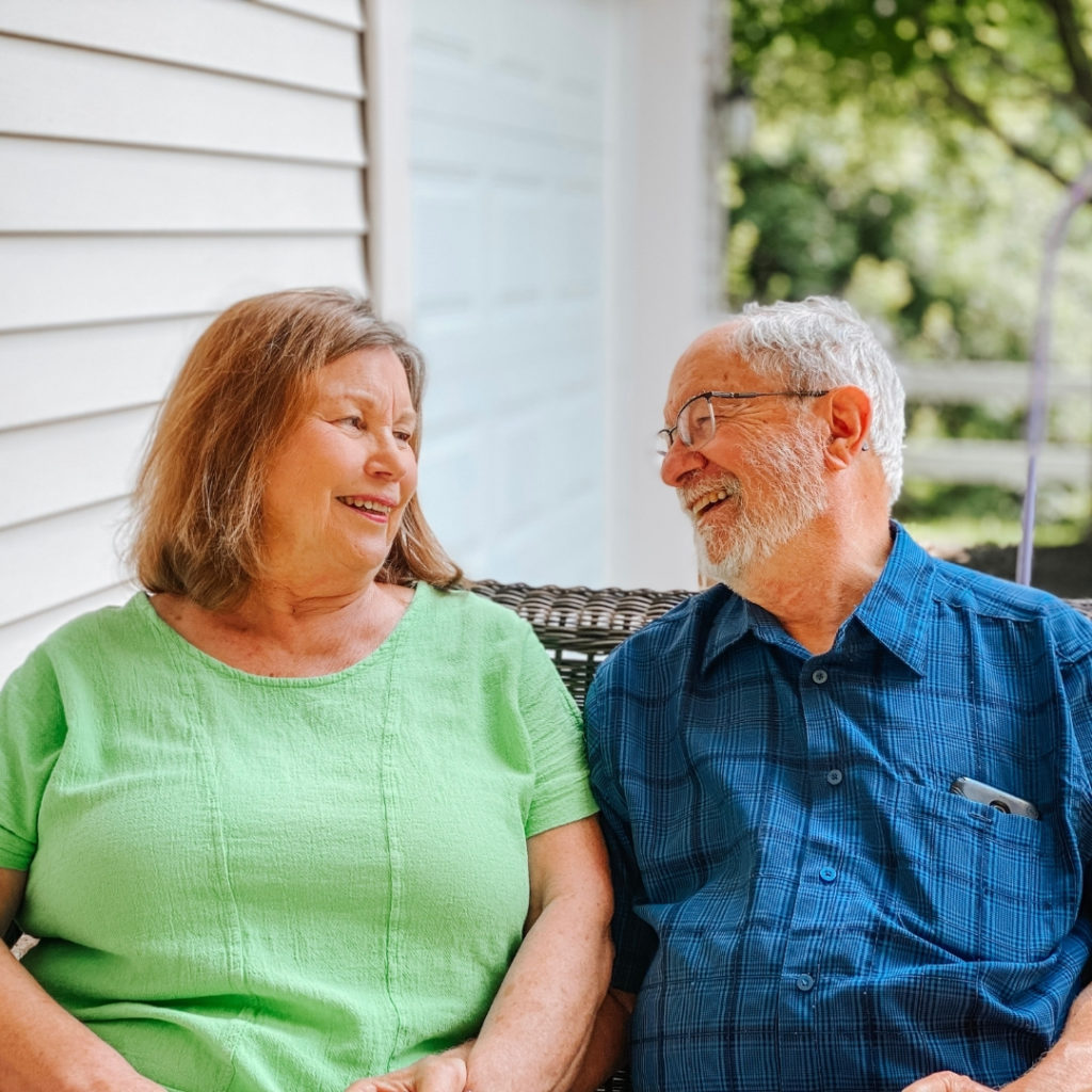 two people sitting on a chair