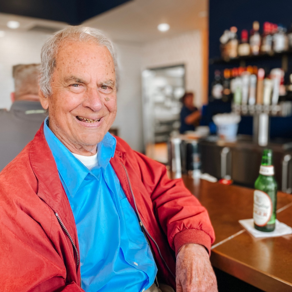 man sitting with a beer